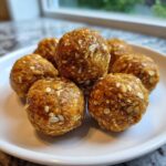 A plate of homemade pumpkin protein balls, showcasing their texture and ingredients like oats.