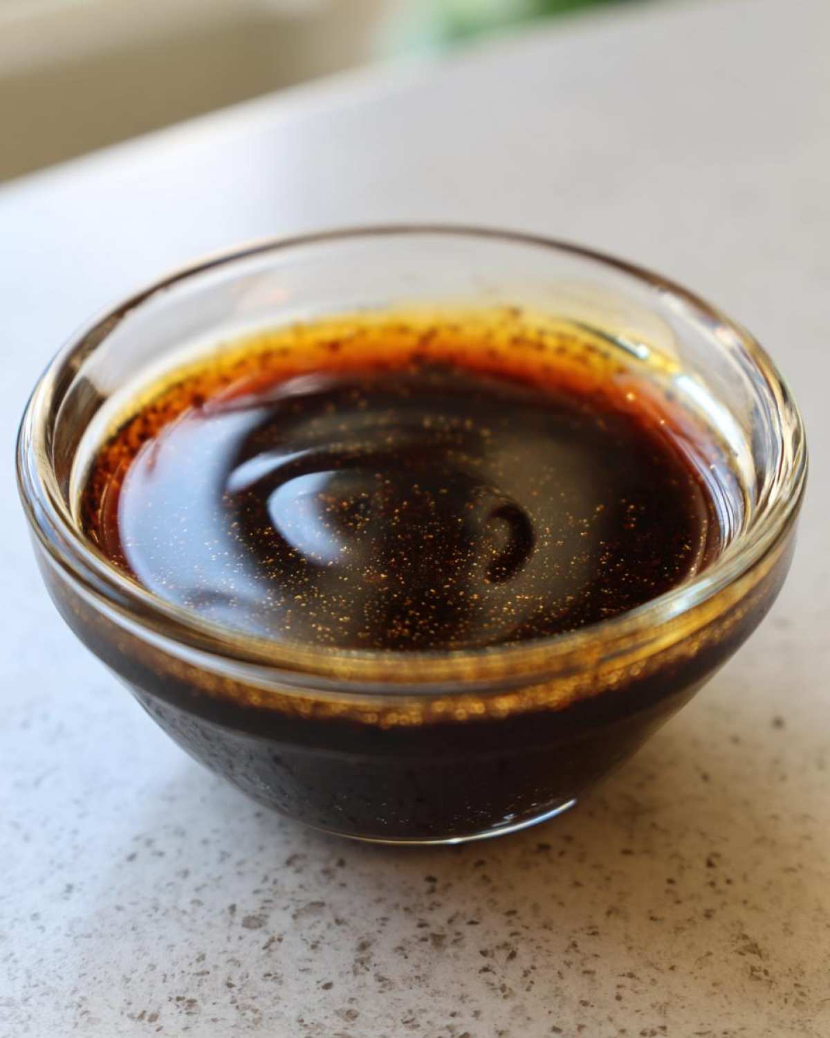 Close-up of flavorful Dumpling Sauce in a clear glass bowl, ready to serve.