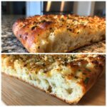 Close-up of Garlic Parmesan focaccia showing the texture and toppings of garlic, parmesan, and herbs.