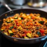 Ground turkey zucchini skillet with tomatoes and herbs in a skillet, ready to serve.