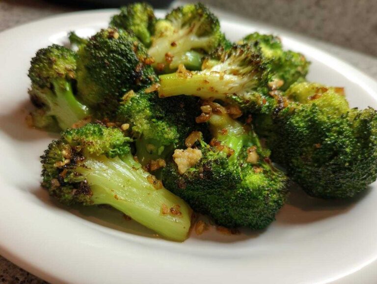A plate of delicious garlic air fryer broccoli, cooked to perfection and seasoned with garlic.