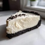 A perfect slice of creamy Philadelphia no bake cheesecake with a dark chocolate cookie crust.
